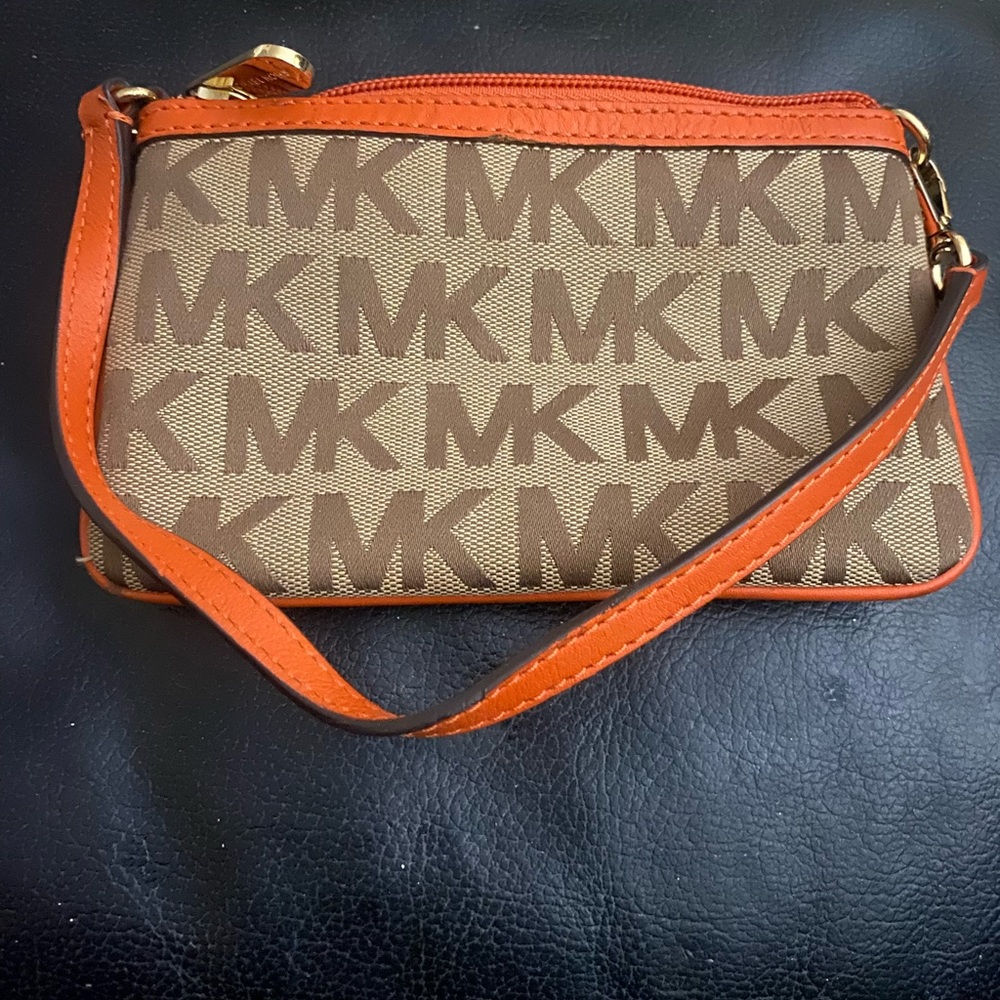 Michael Kors orange/tan wristlet in great condition